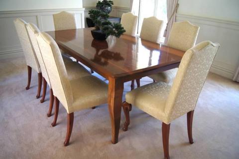 Solid wood dining table with 8 cream chairs - as new