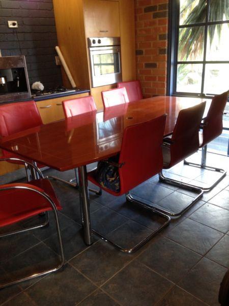 Dining Board Room Timber Table comes with 8 red leather chaiss