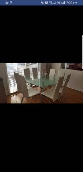 8 seat glass Adriatic table and white chairs