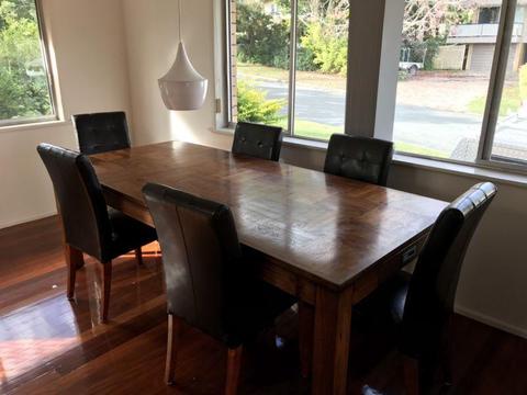 Timber table and leather chairs