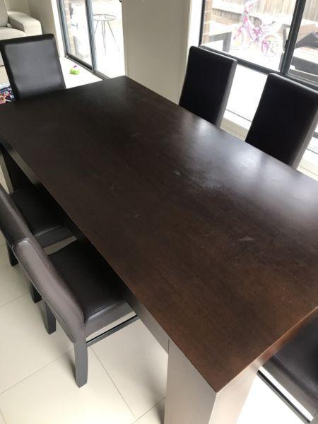 Wooden dining table with 6 leather chairs