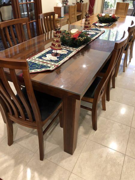 Yarra Glenn Timber table with 8 padded chairs. Glass on top