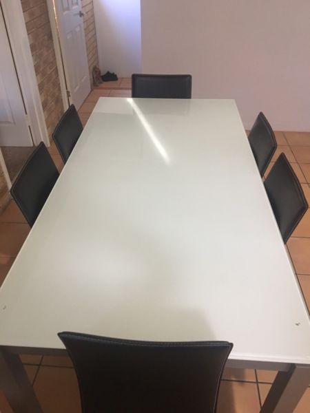 Great glass dining table with 6 chairs and a small matching table