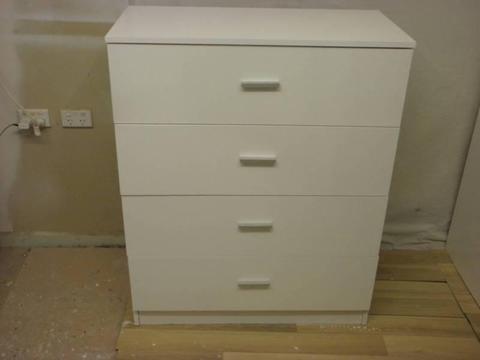white chest of drawers on rales