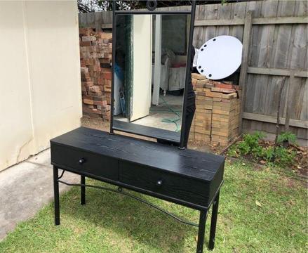 Black dresser with cast iron mirror