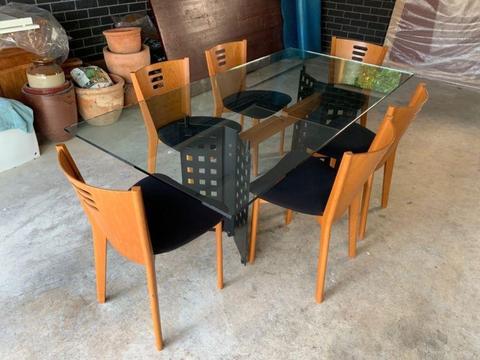 Italian designer glass dining table with 6 timber chairs