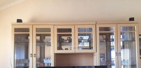 Large wall unit 3 piece mirrors in background, glass