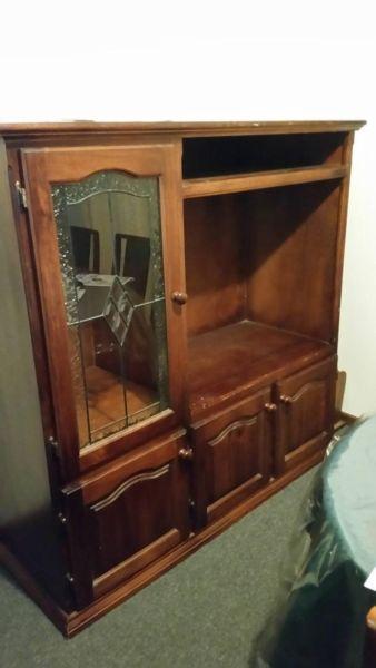 Huge wooden and glass T. V cabint