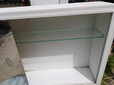 Medicine cabinet with glass shelf