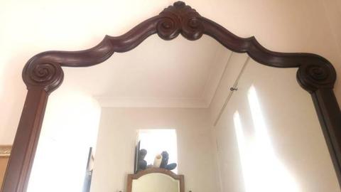 Beautiful mirror in carved wood frame