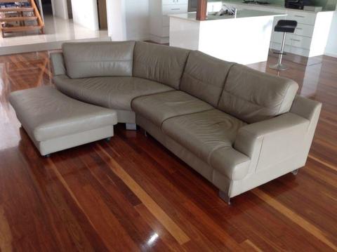 Curved leather lounge sofa