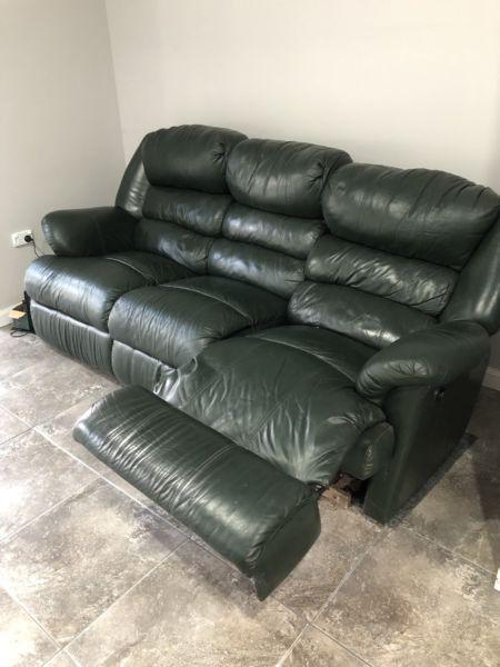 Dark green leather lounge with recliners on both ends