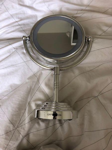 Two sided makeup mirror