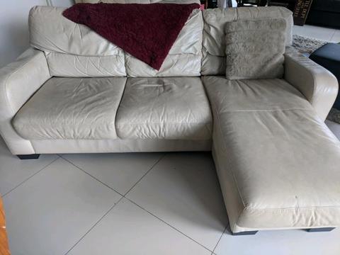 Cream leather couch with ottoman