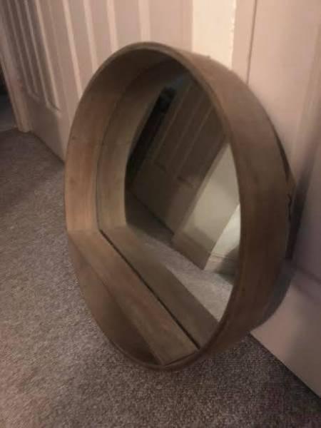Large circular mirror with shelf