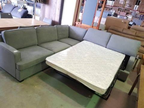 MARKED DOWN!! Corner fabric lounge pull out sofabed LIGHT GREY