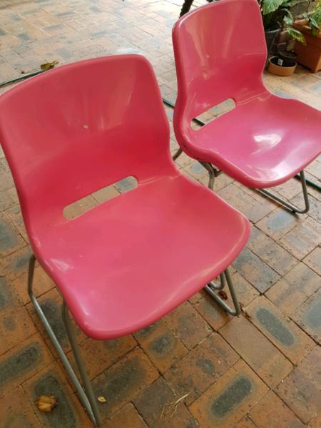 IKEA pink plastic chairs