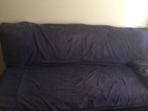 Used sofa dual function with cover