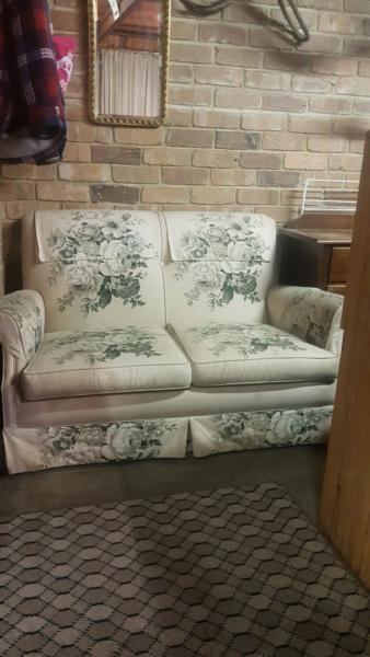 Old floral 2 seater lounge