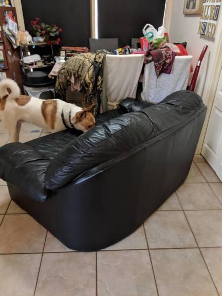 Leather couches and heaps of cheap furniture