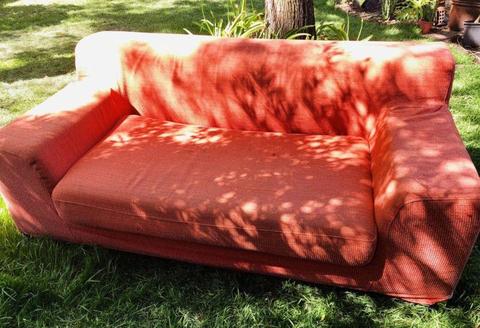 2 seat peach coloured sofa couch