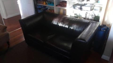 Dark leather look couch 2 seater