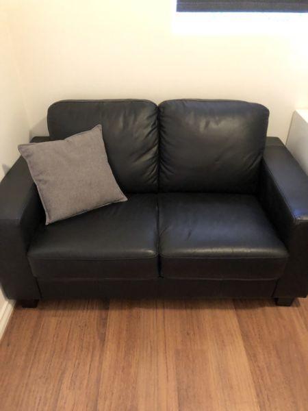 Black leather 2 seater couch