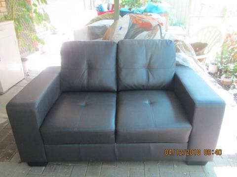 2 seater lounge in v.good condition. Dark Brown. 1