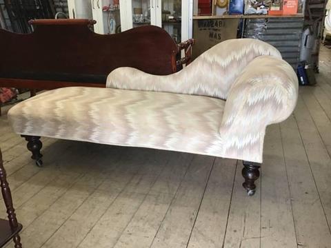 Vintage upholstered chaise lounge couch sofa on castors