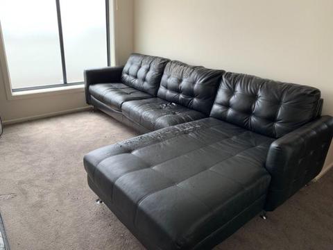 Black leather couch, worn