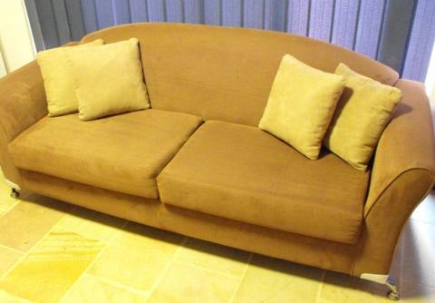 CHOCOLATE COLORED SOFA WITH 4 CUSHIONS