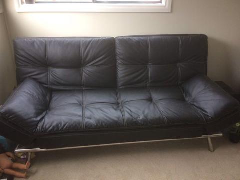 Leather sofa turns into a double bed