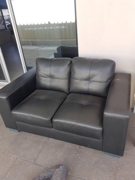 Black faux leather couch 3 by 2