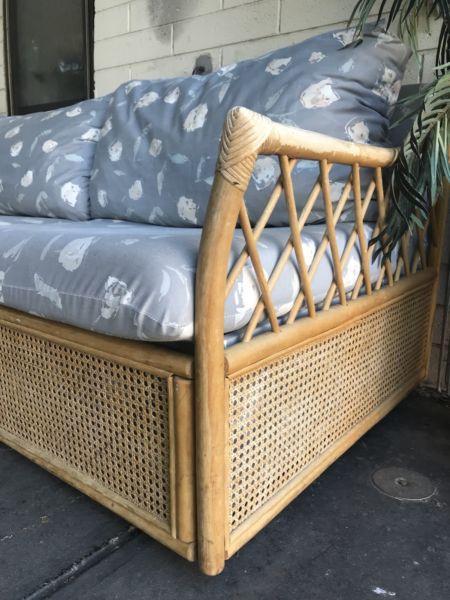 Cane lounge with fold out bed