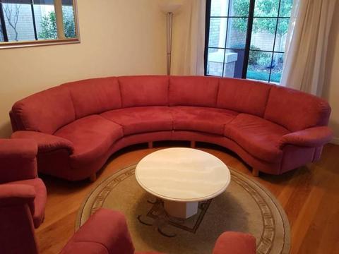 Custom made circular couch with two accompanying chairs