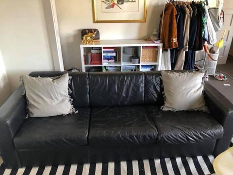 Leather three seater black couch and arm chair