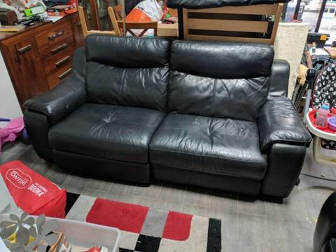 Two black leather 2.5 seater couch recliner