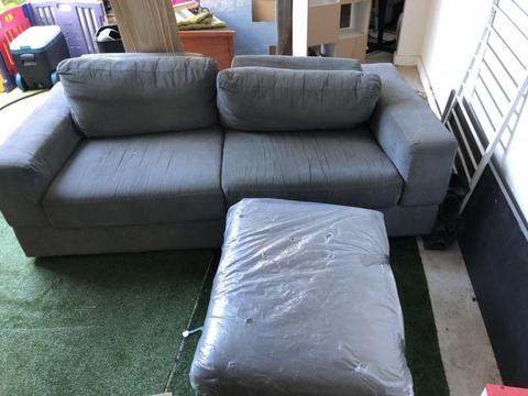 Blue/grey sofa with foot rest