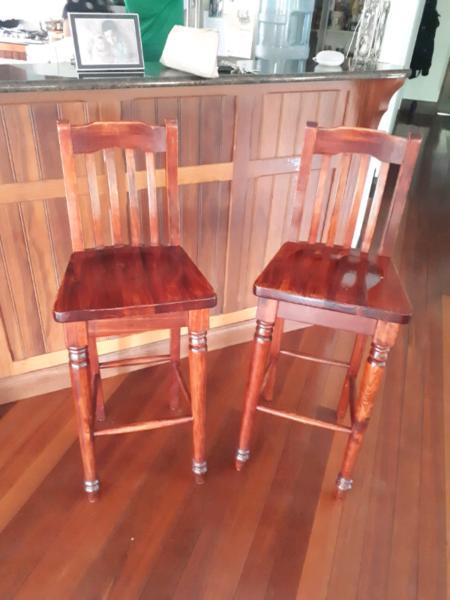 Four wooden bar stools