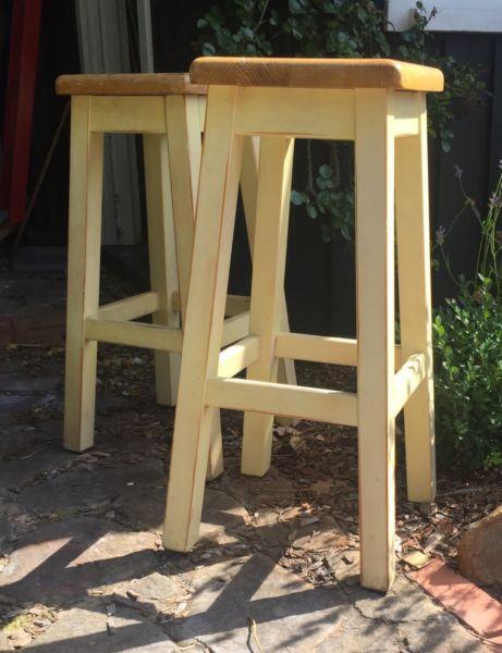 Two solid wooden stools