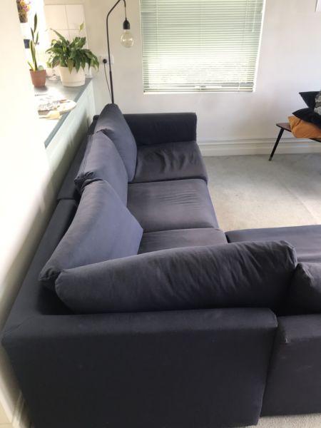 Navy blue L- shaped couch