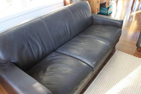Two leather 3 seater couches plus matching leather ottoman