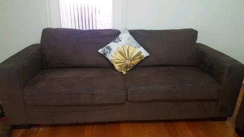 Three seater brown couch