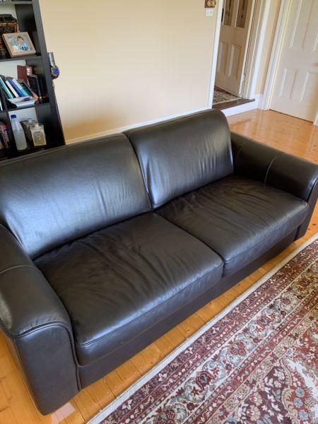 Two Plush dark leather 2 seater couches. Great condition