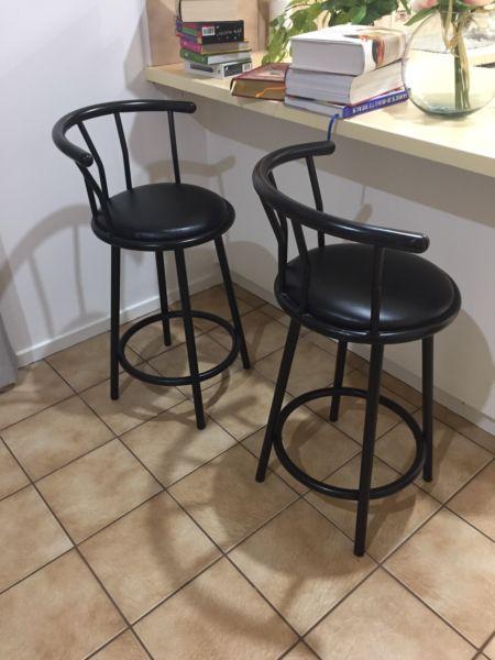 Two black bar seats stools