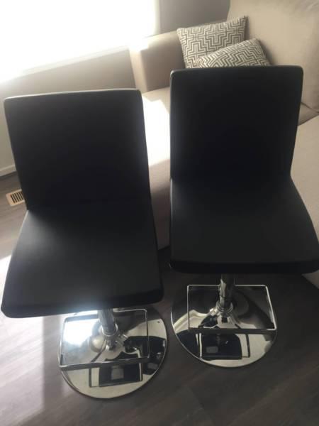 4 black stool chairs