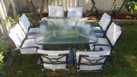Outdoor square glass table with 8 chairs