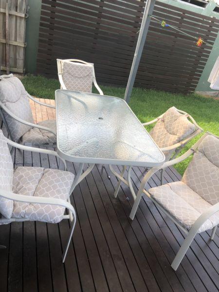 Outdoor Glass table setting with 6 Chairs