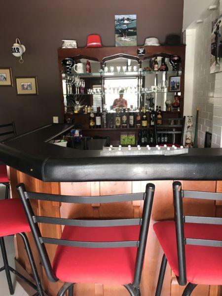 Bar and shelving unit with stools included