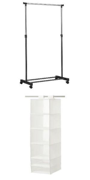 White hanging organizer and single clothes rack